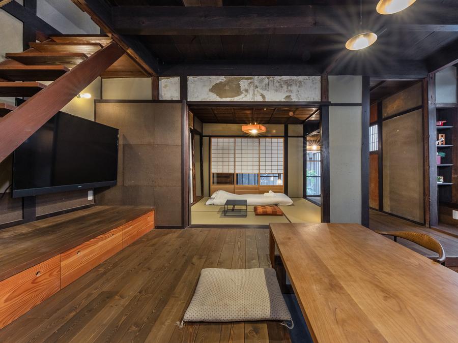 The Bisho House, Kyoto, with its timber dining space and tatami room.